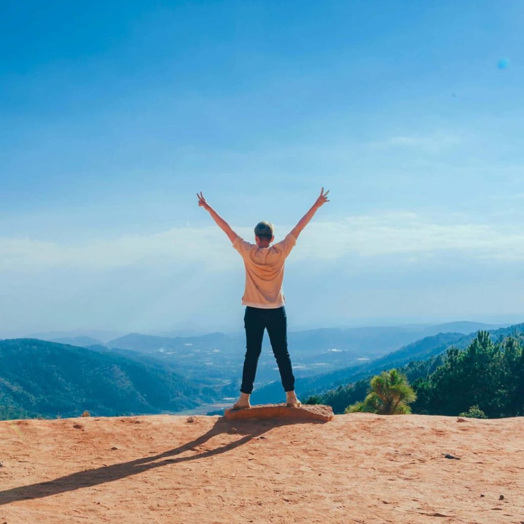 Person at top of mountain